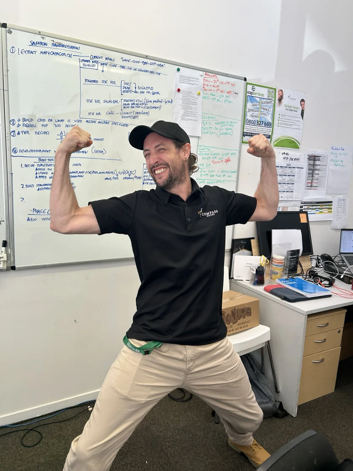 Ryan flexing in an office